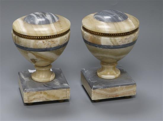 A pair grey and beige marble lipped urn shaped bookends height 18cm